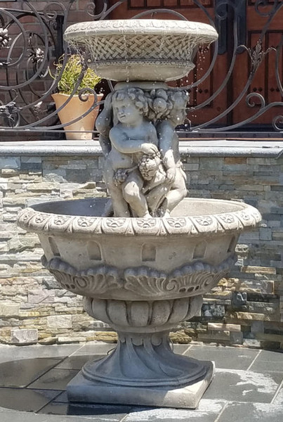 Fountain of Playful cherubs cascades striking Henri Renaissance theme